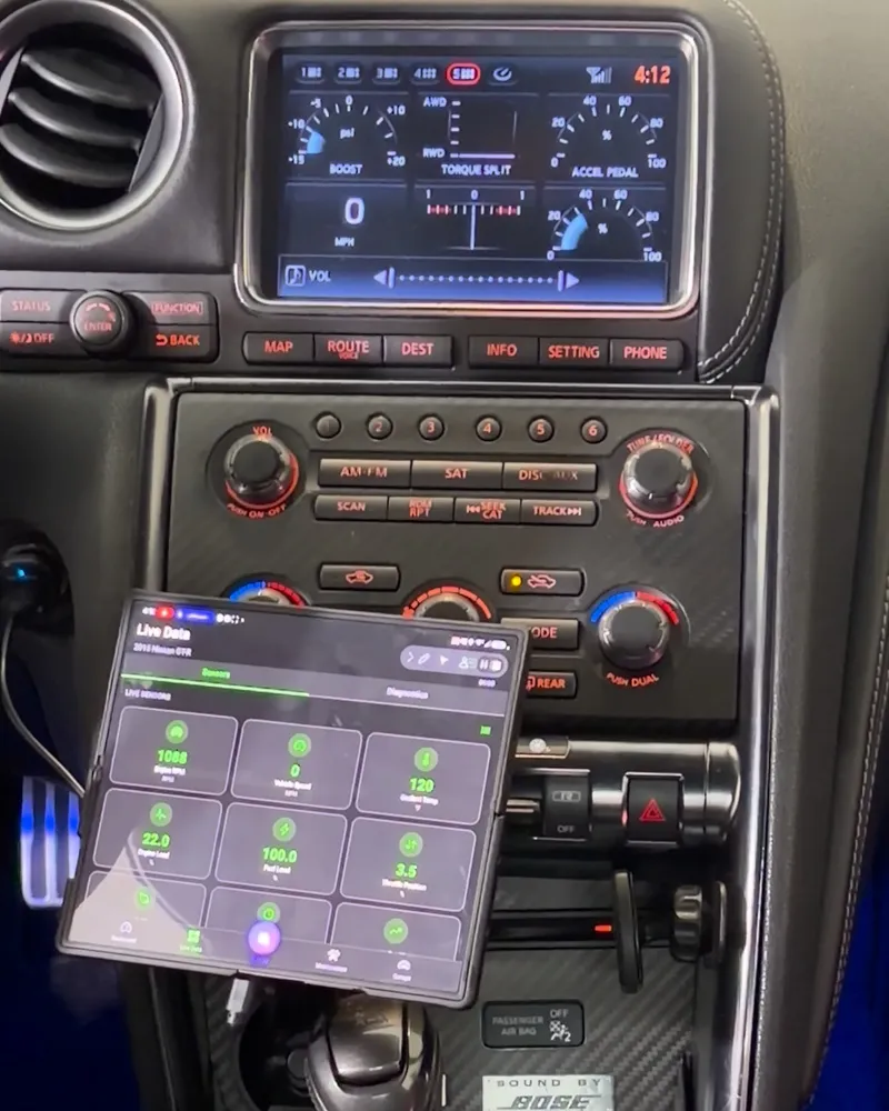 Two MFDs. The GT-R's own up top. Live OBD2 on a Z Fold 6 below: rpm, speed, coolant temp, engine load, fuel level and throttle. Runs off a Bluetooth LE OBD2 …